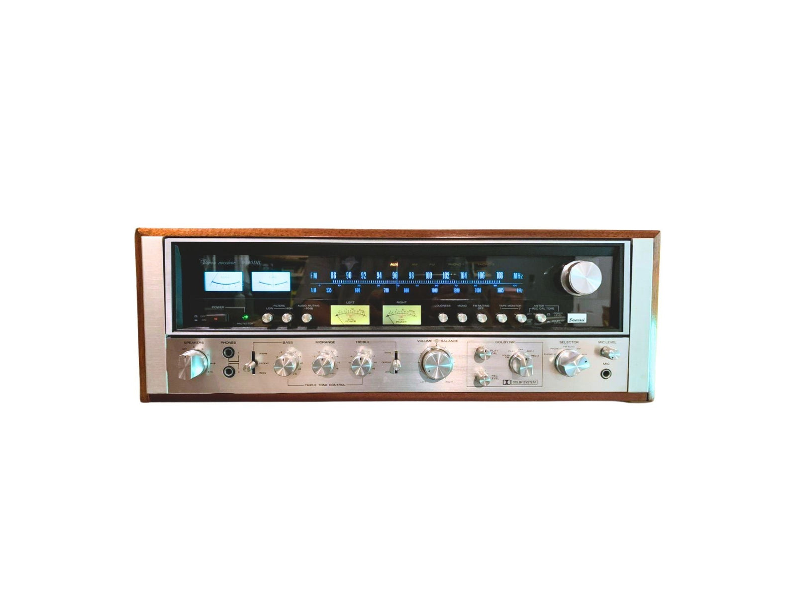 Sansui 9090DB stereo receiver with brushed aluminum faceplate, green dial glow, wood cabinet, and large tuning knob — a classic of the 1970s hi-fi era.